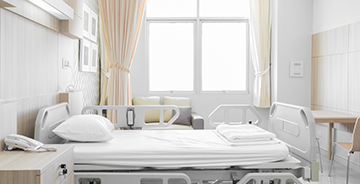 Hospital room with bed and medical equipment
