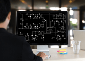 A drafter working on a control system schematic